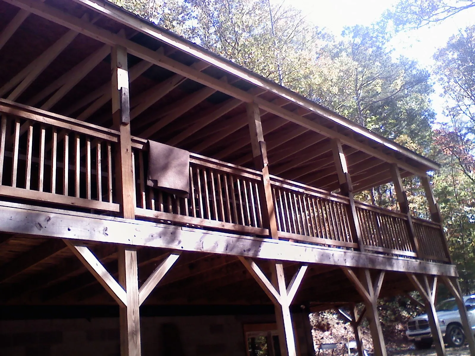 Timber framing under a new elevated porch and deck — Roof Leak Repair in Millersburg by Roofing Brothers